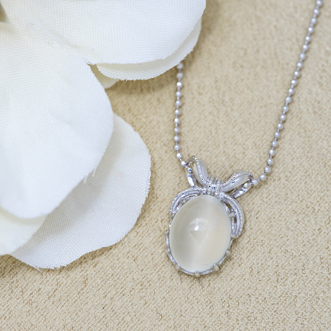 umu -アム- FINE JEWELRY STUIDIOムーンストーン リボンモチーフ ペンダントトップ 「regalo」pn0461_1.jpg