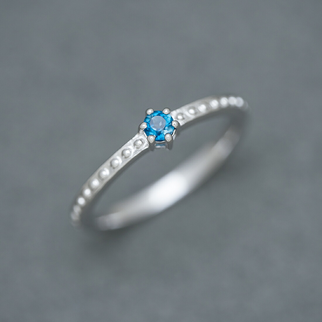 umu -アム- FINE JEWELRY STUIDIOロンドンブルートパーズ リング 「parca」rg0370_kanban2.jpg